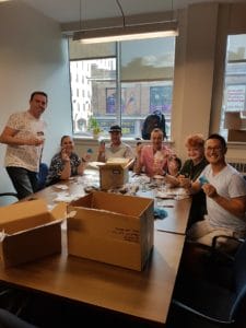 MAX Volunteers helping us make safer sex and partying kits