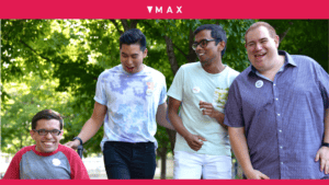 group of 4 MAX volunteers holding hands in park